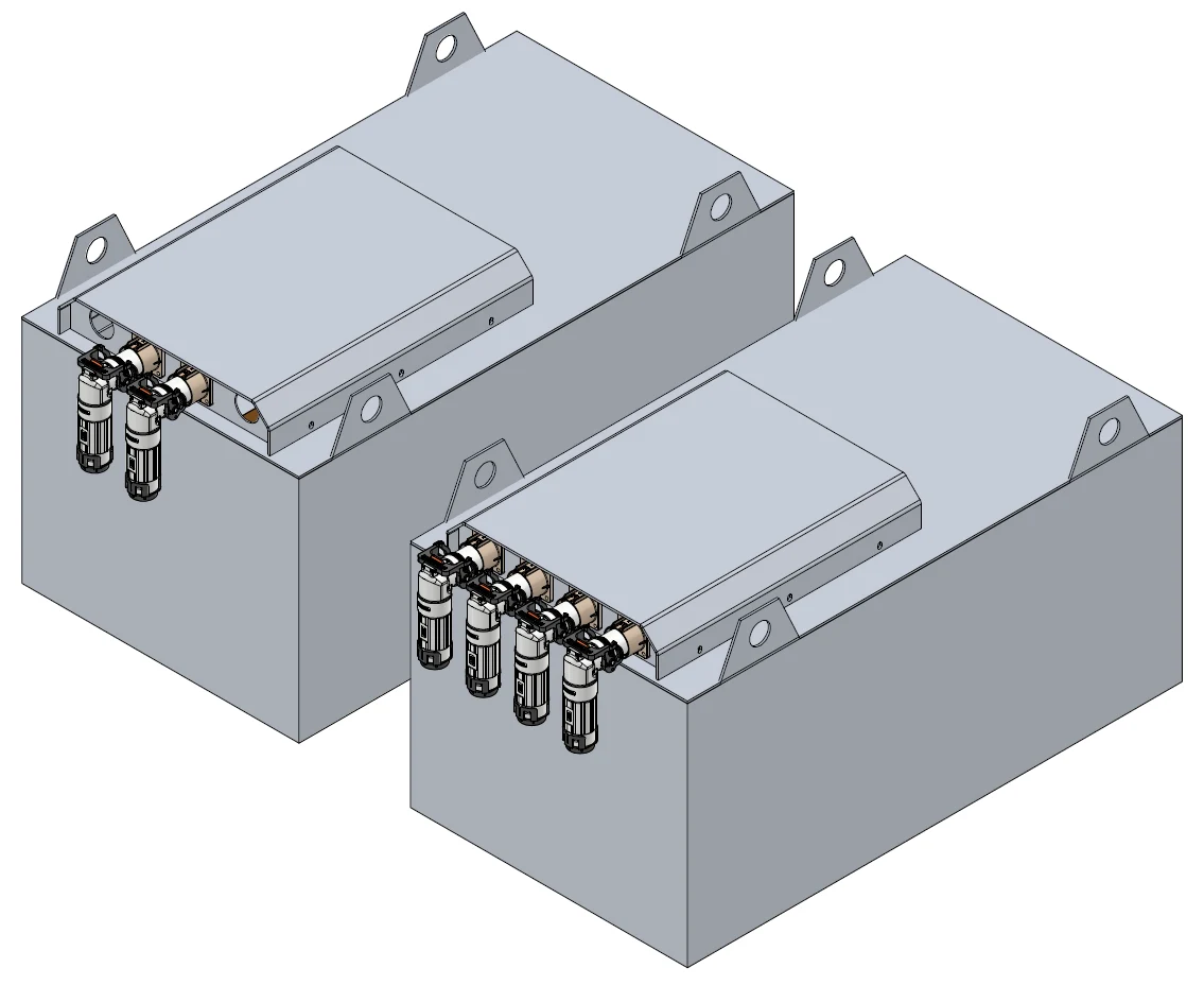 Two battery packs: grey steel boxes with lifting eyes, a raised connector cover on top and power connectors on the end face